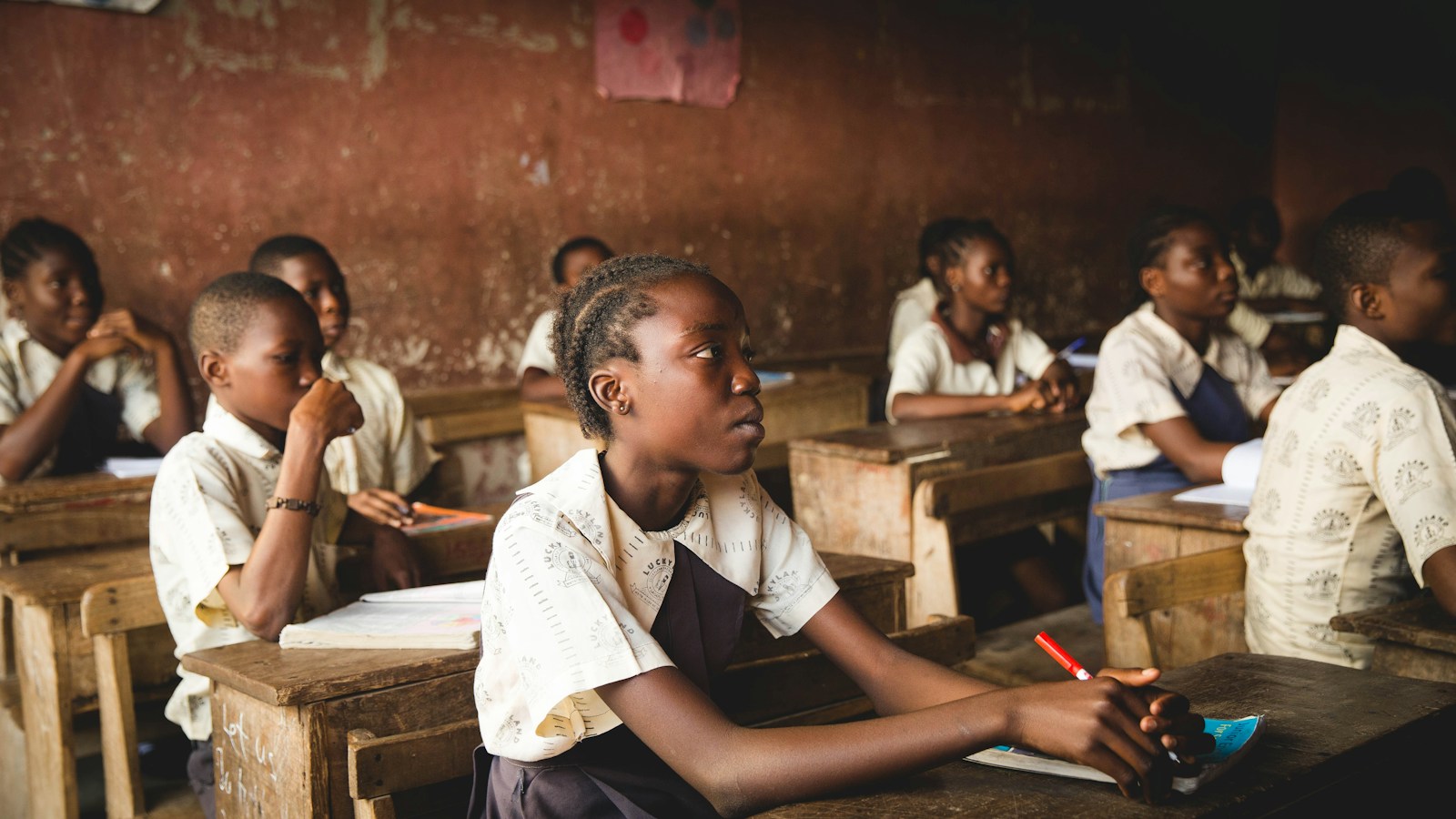 African teacher guiding a classroom
